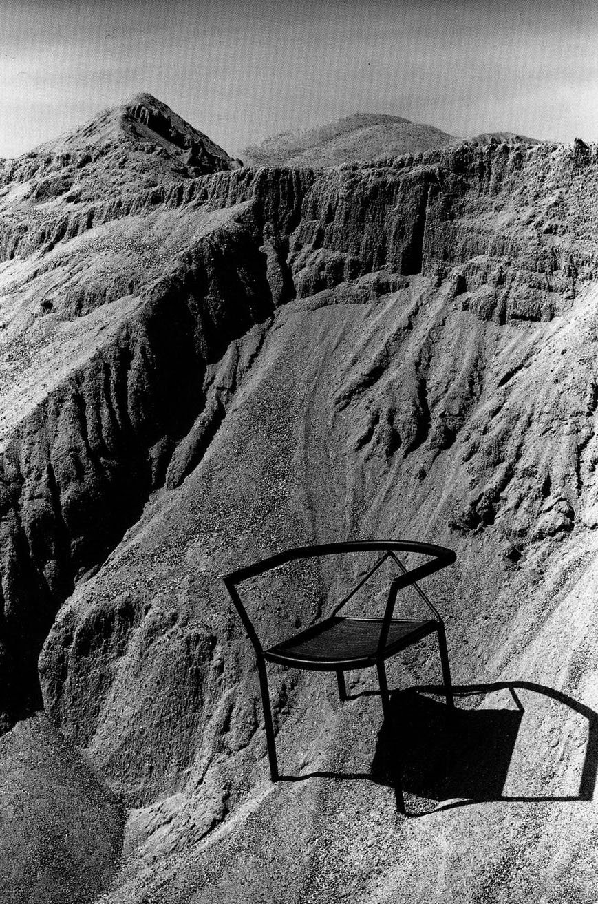 poltroncina chair submerged in the sand